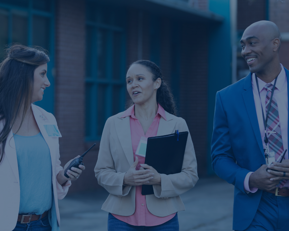 School leadership walking together talking about instruction and curriculum.